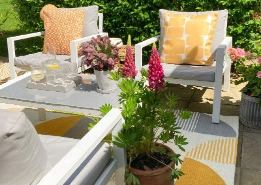 Two orange outdoor cushions