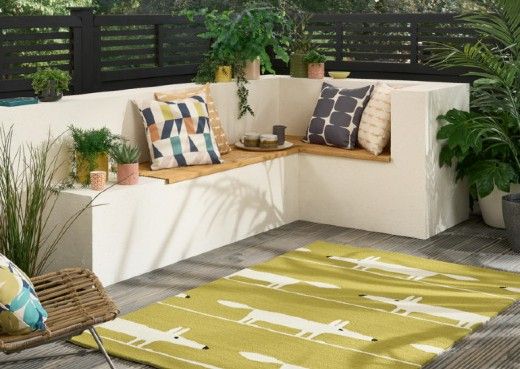 A Mr Fox outdoor rug, along with a number of colourful outdoor cushions